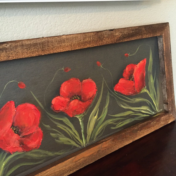 Fields of red poppieswith pallet wood frame