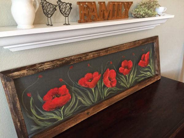Fields of red poppieswith pallet wood frame