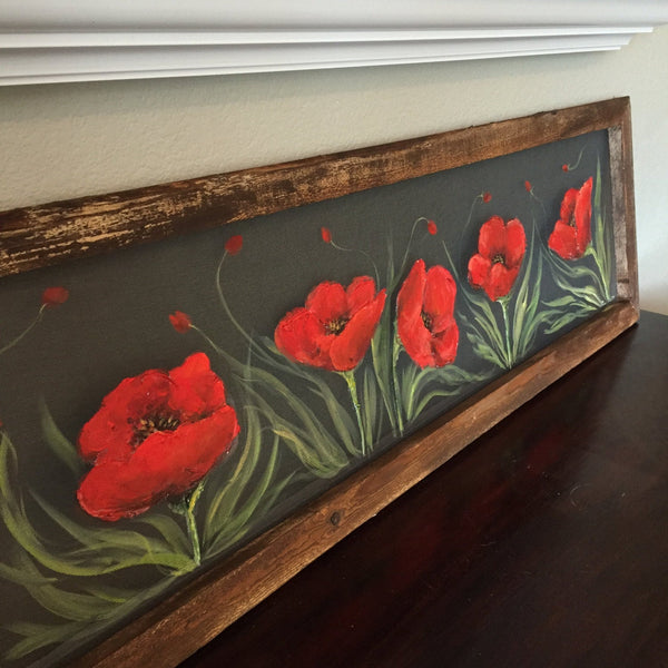 Fields of red poppieswith pallet wood frame